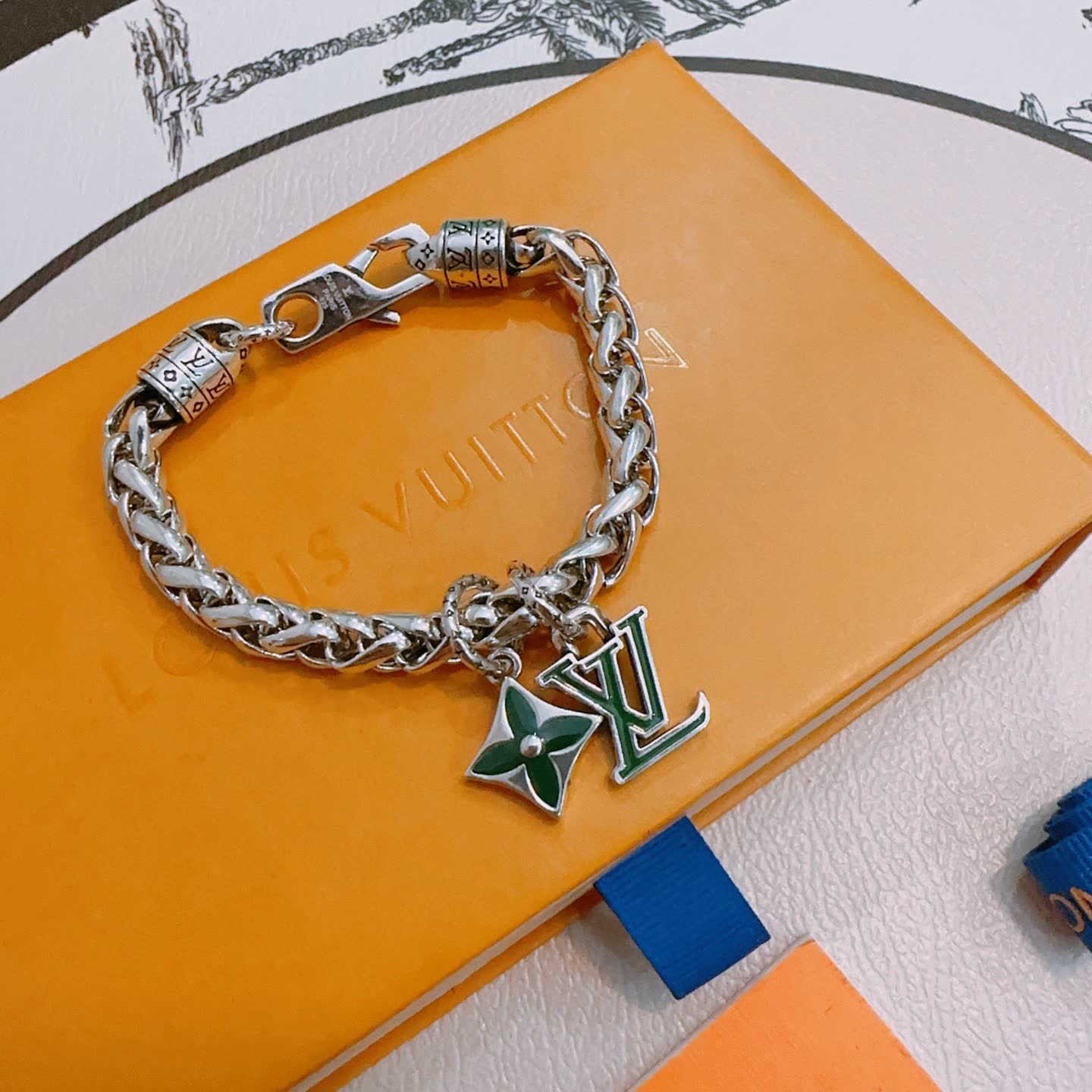 Louis Vuitton Silver Bracelet with LV Logo and Green Flower Charm